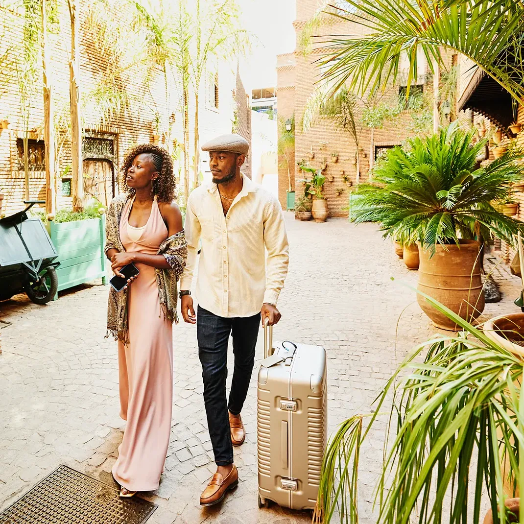 Couple walking with luggage