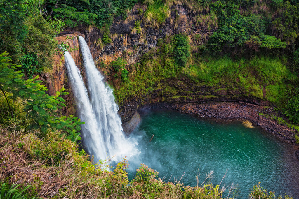 waterfall feeding a lake below