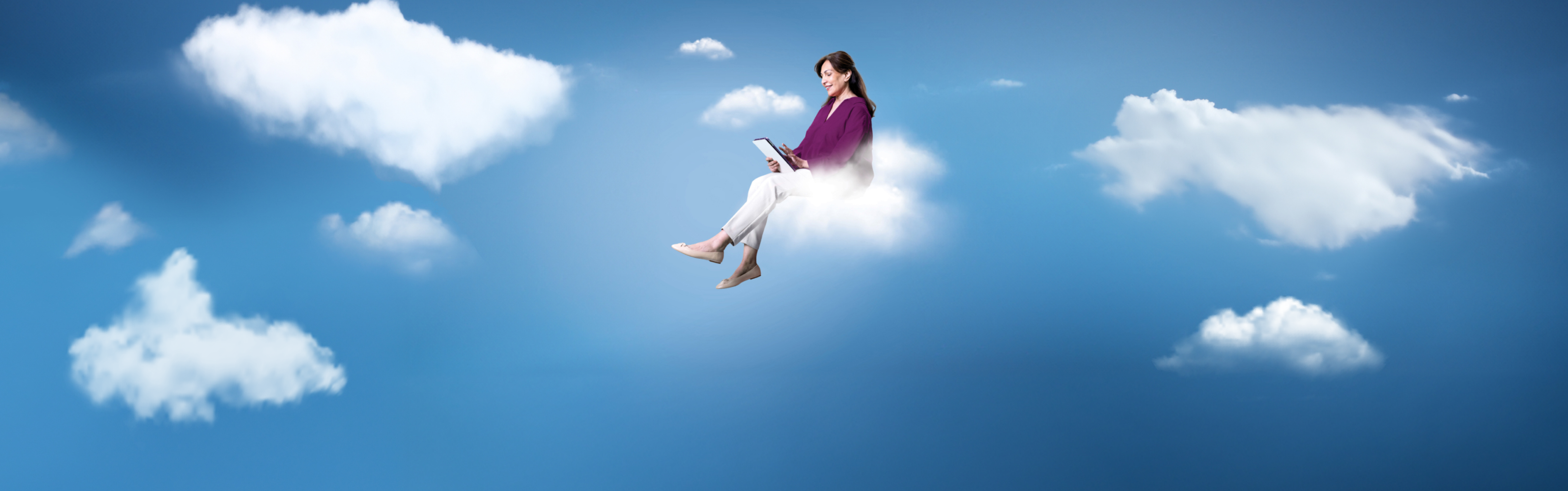 woman sitting on cloud reading